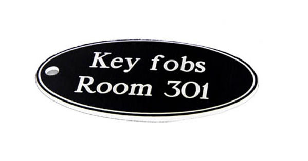 Picture of 50x100mm Key fob oval - White text on black
