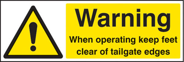 Picture of Warning when operating keep feet clear of tailgate edges